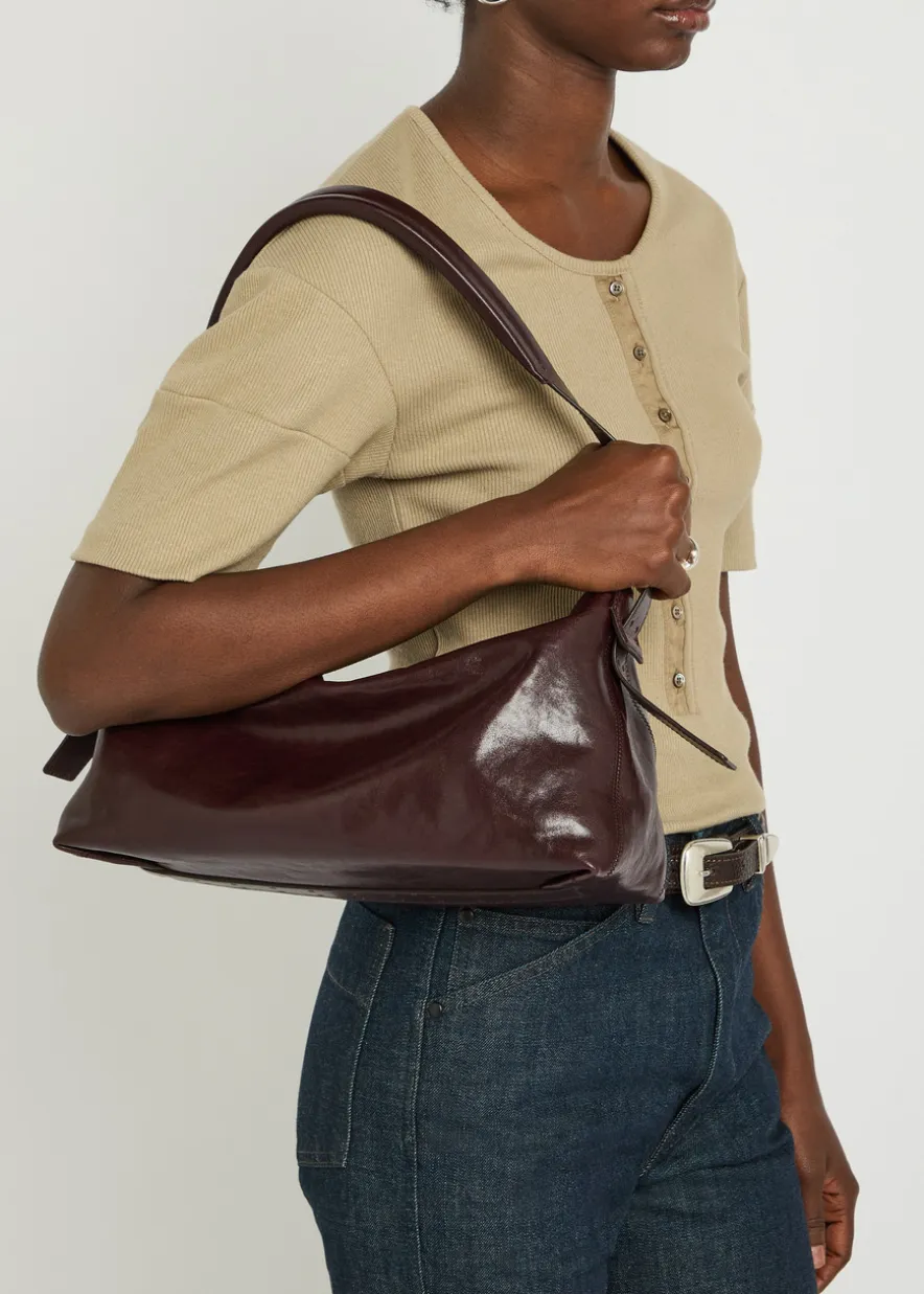 Belted baguette leather shoulder bag