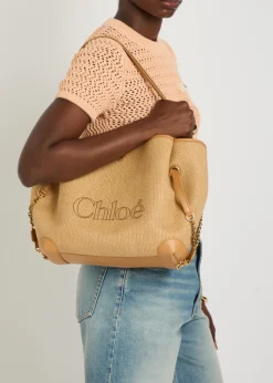 Clover logo-embroidered raffia tote bag