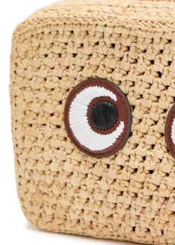 Eyes appliquéd raffia cross-body bag
