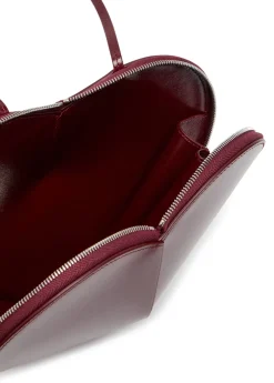 Le Couer glossed leather cross-body bag