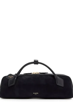 Le Teckel suede clutch