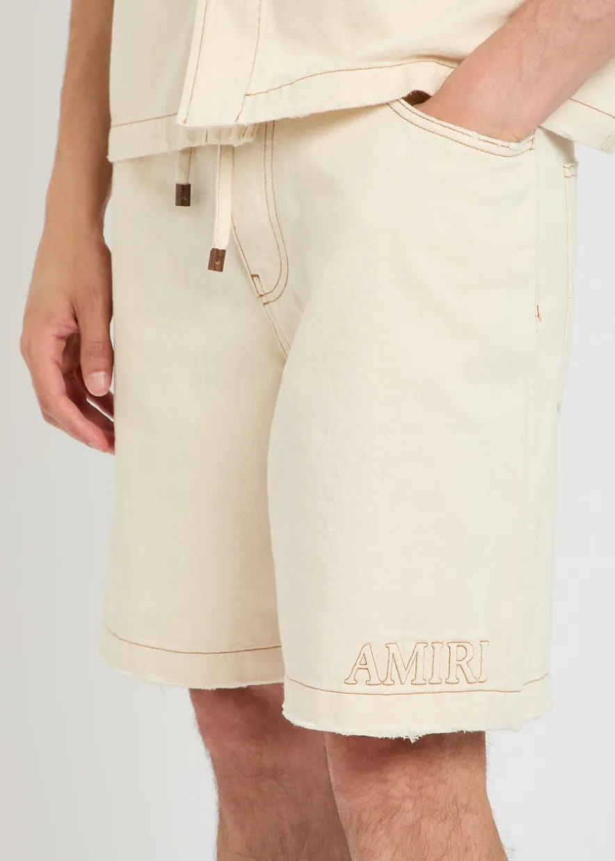 Logo-embossed distressed denim shorts