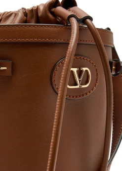 Logo-plaque leather drawstring bucket bag