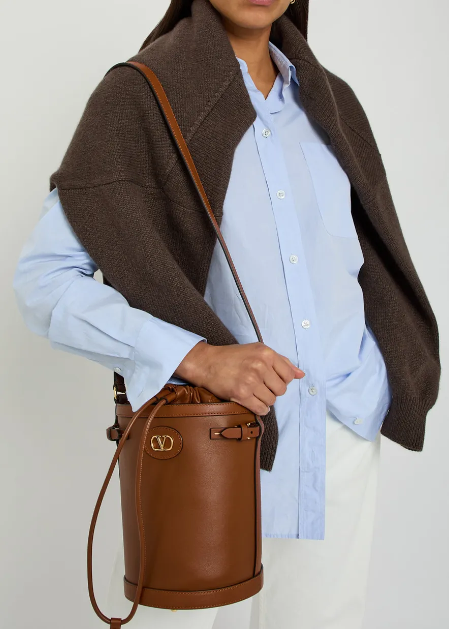 Logo-plaque leather drawstring bucket bag