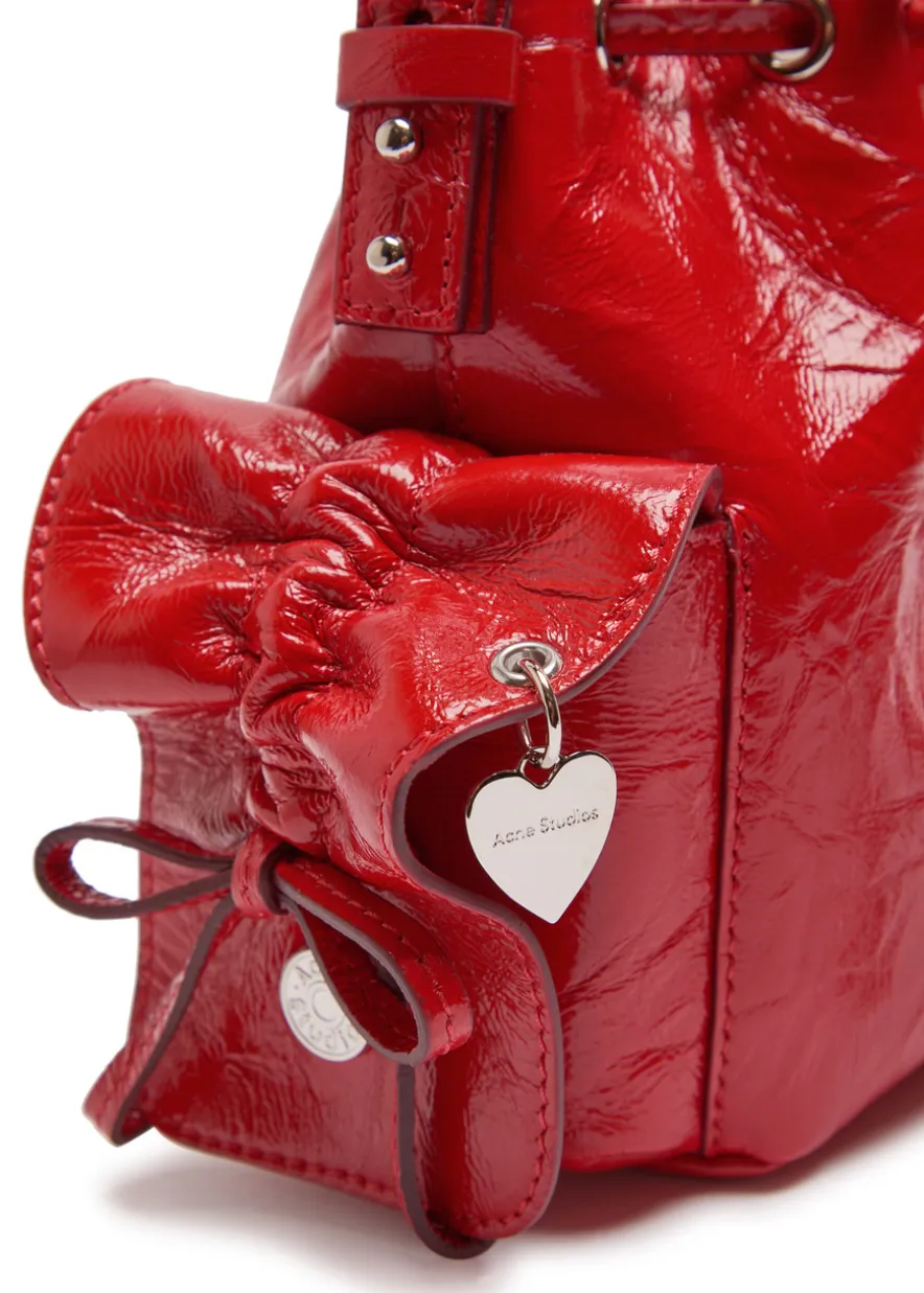 Multipocket mini patent leather bucket bag