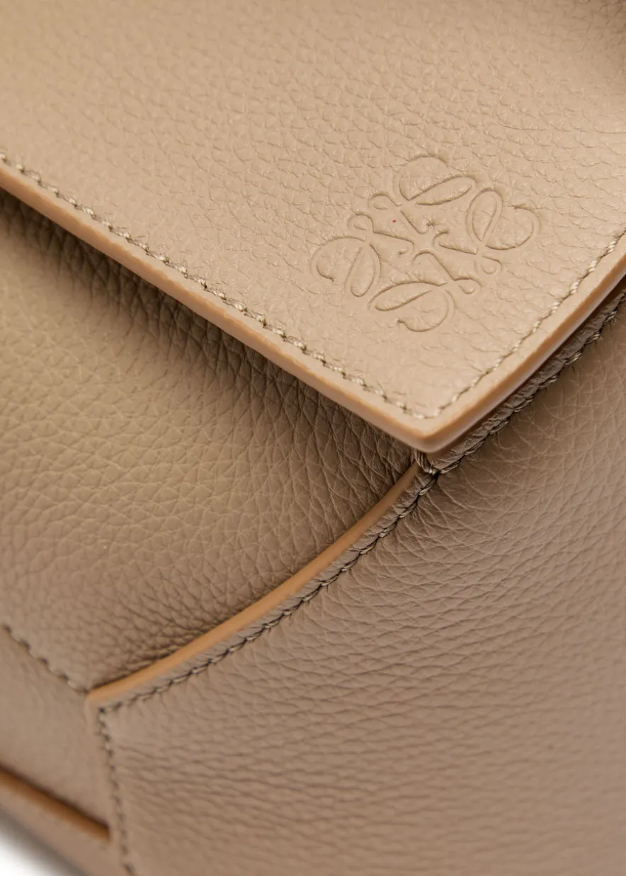 Puzzle Edge small leather top handle bag