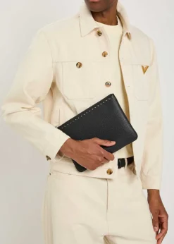 Rockstud-embellished grained leather pouch