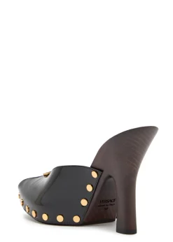 105 stud-embellished wooden and patent leather mules